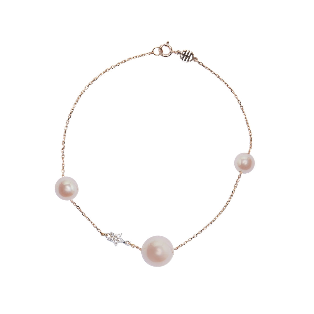 Bracciale con perle rosa e stella di diamanti