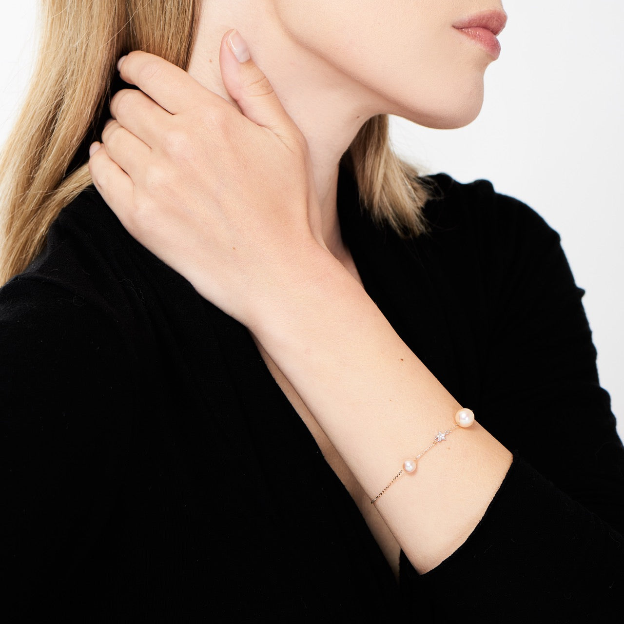 Bracciale con perle rosa e stella di diamanti